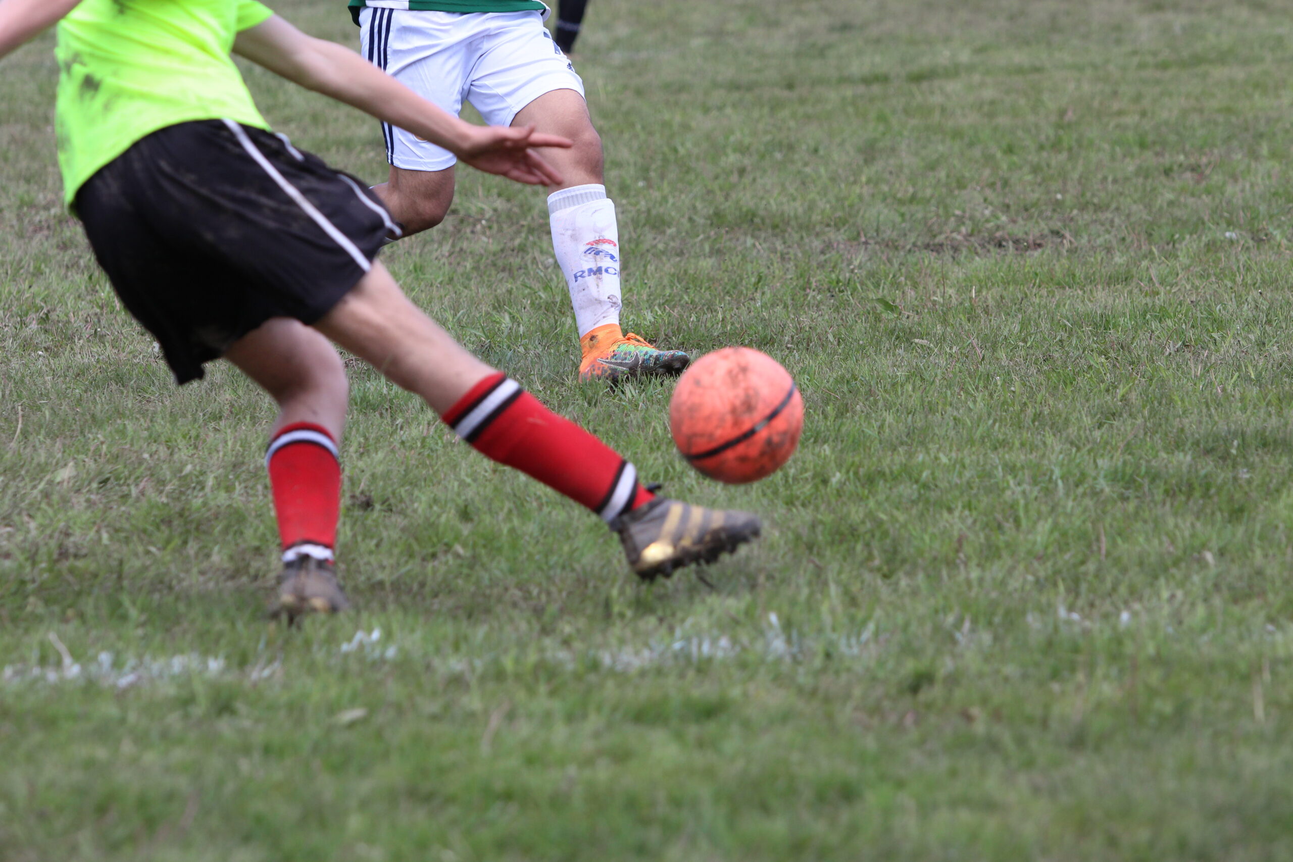 Two children playing football